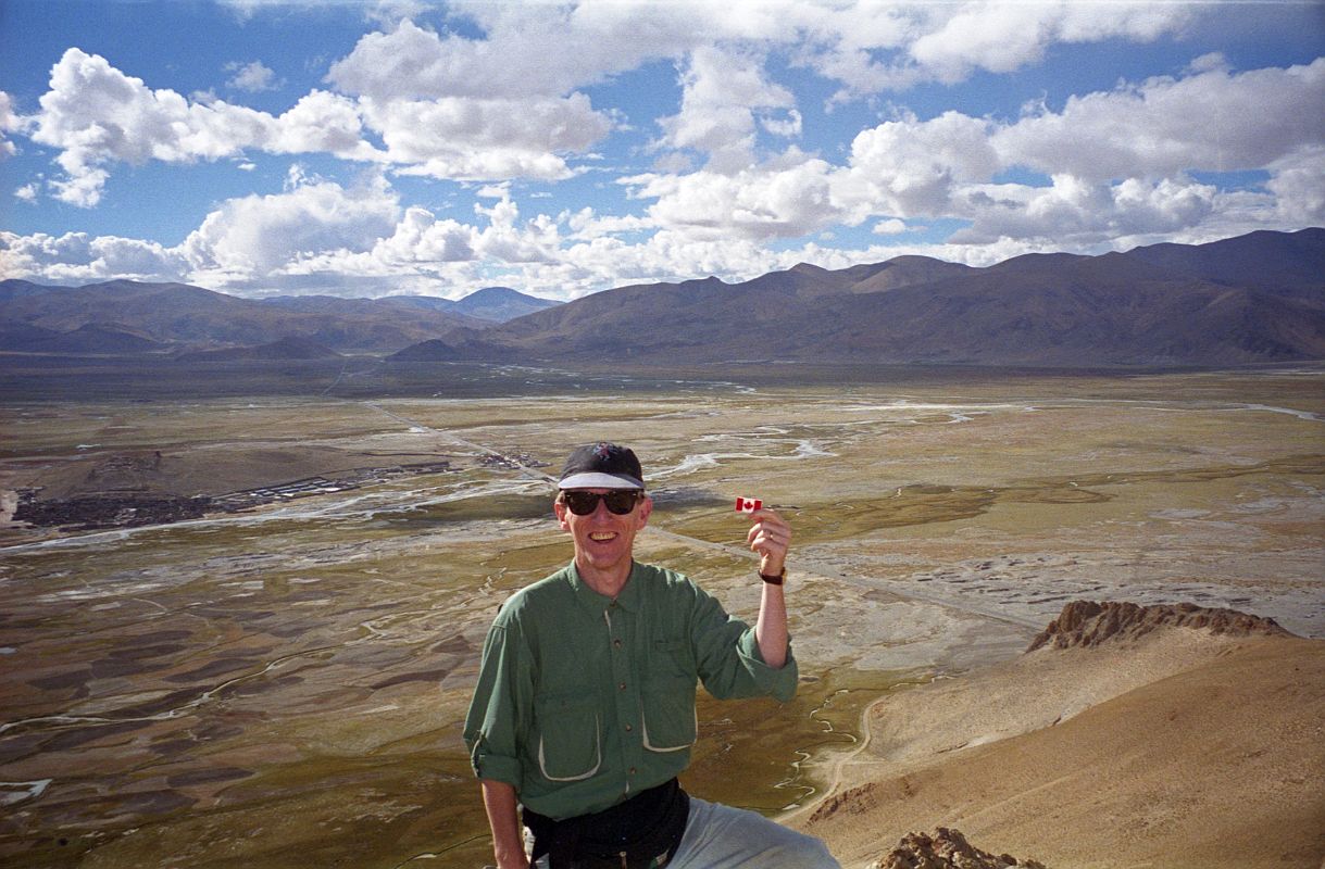16 Jerome Ryan On Top Of Hill With Tingri And Tingri Plain Behind In 1998 In 1998 Jerome Ryan, with Tingri behind, climbed a nearby hill to help acclimatization.